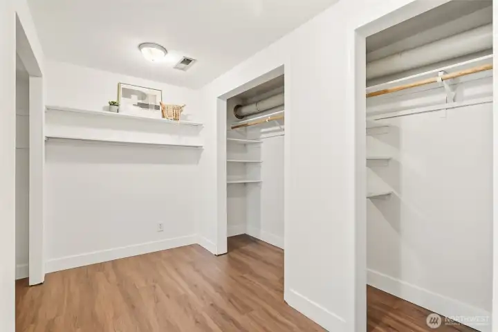 Expansive walk-in closet with abundant hanging space and storage