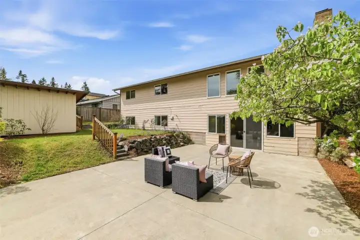 Fully fenced backyard with expansive patio and plenty of space for outdoor living