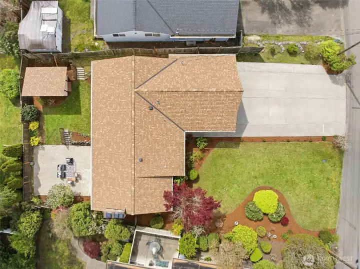 Top-down aerial highlighting generous yard, patio, and overall layout