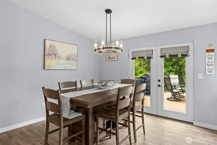 Spacious dining room with back deck access to extend your gatherings outdoors!