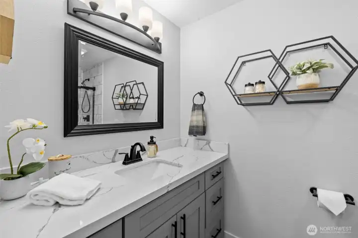 Updated primary 3/4 bath en suite with heated floors.