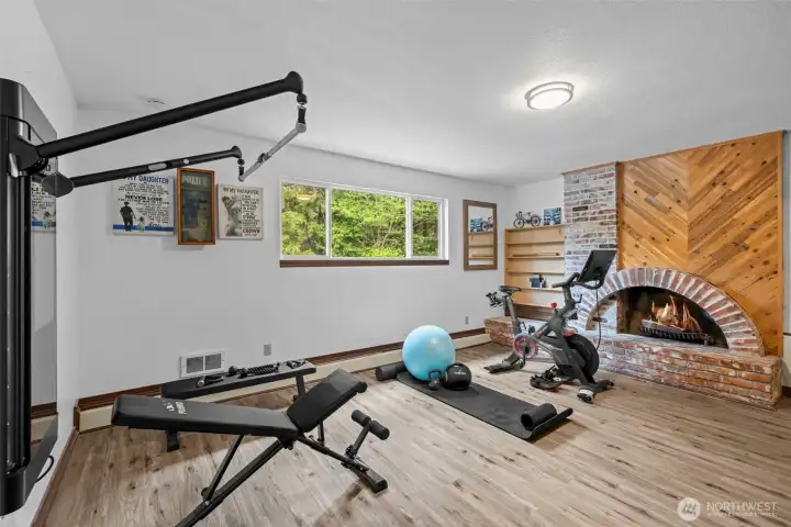 Lower level provides a wonderful recreation space with your end use in mind. Wood burning fireplace.