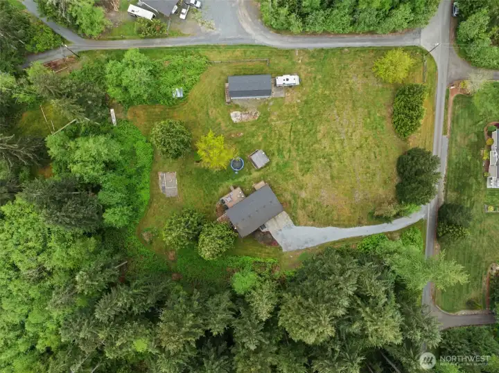 Top down aerial. Covered parking for approximately 6 cars & the ability to accommodate onsite parking for up to approximately 16 vehicles.