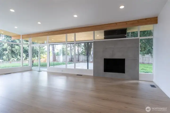 Living room with wood fireplace and eating area