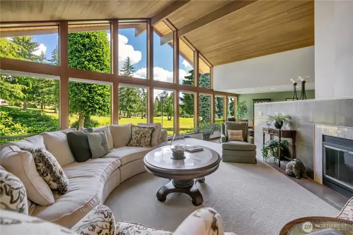 Living Room with vaulted ceiling & warm wood beams.