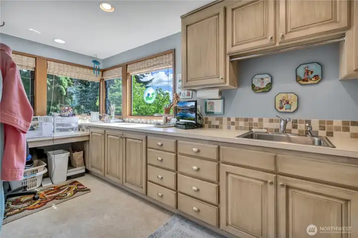 Another view of the laundry room also used as a sewing room, or office.
