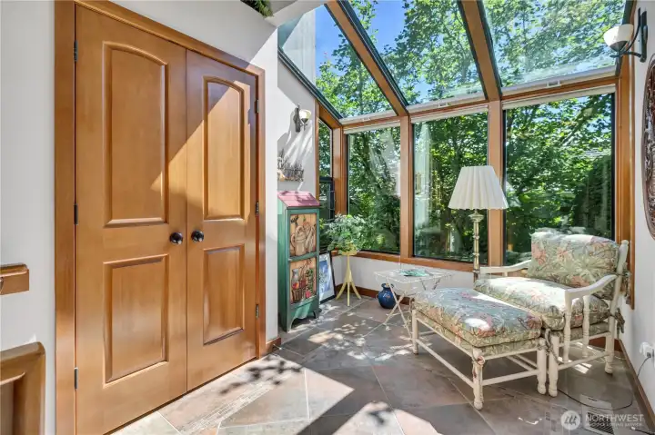 Sun room with storage closet.