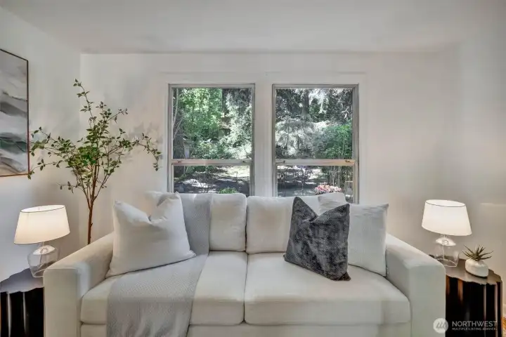 serene living views and light from the lush backyard.