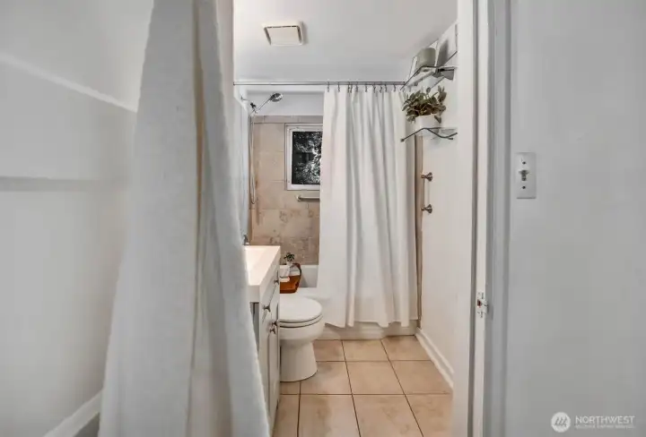 Full bath with new vanity and handlebars for safety
