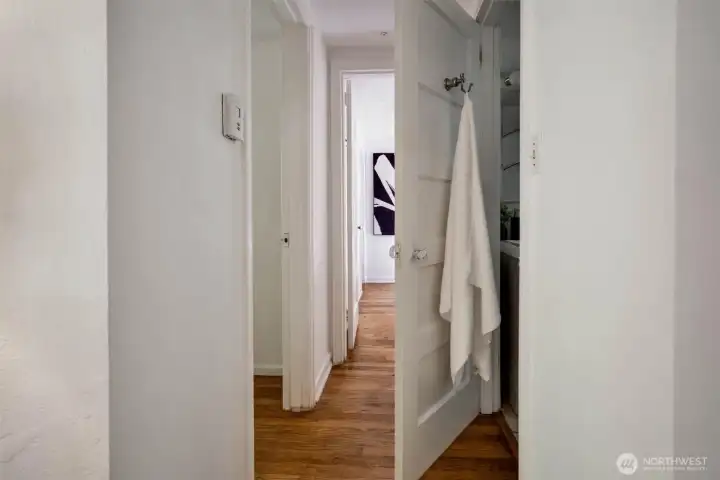 Hall way to full bath and two bedrooms