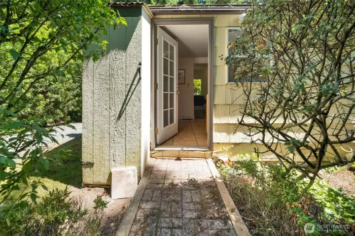 Access to the kitchen from the back yard and Hot water tank storage.