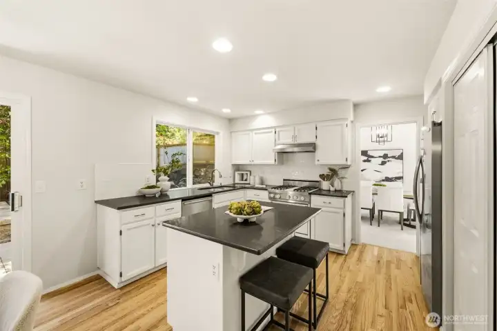 The kitchen provides ample storage space with plentiful cabinets, a large pantry, and an island for easy meal prep The kitchen provides ample storage space with plentiful cabinets, a large pantry, and an island for easy meal prep