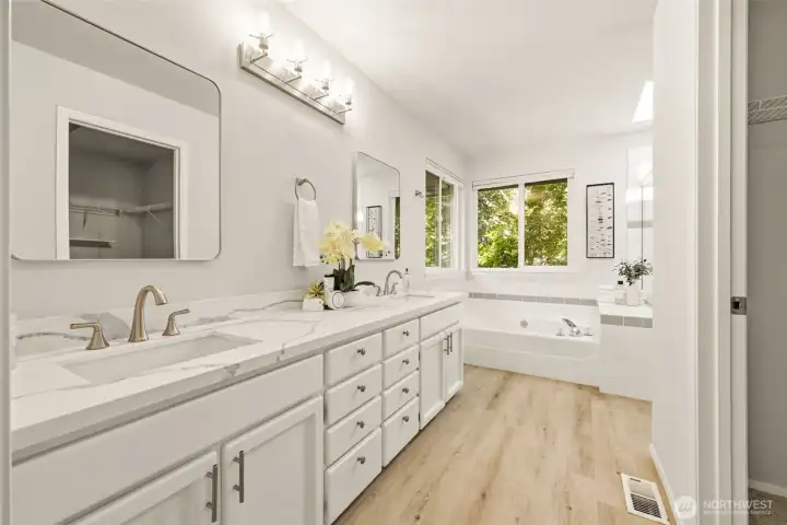 The 5 piece ensuite bath features dual vanities, a large soaking tub, spacious shower, and a separate water closet The 5 piece ensuite bath features dual vanities, a large soaking tub, spacious shower, and a separate water closet