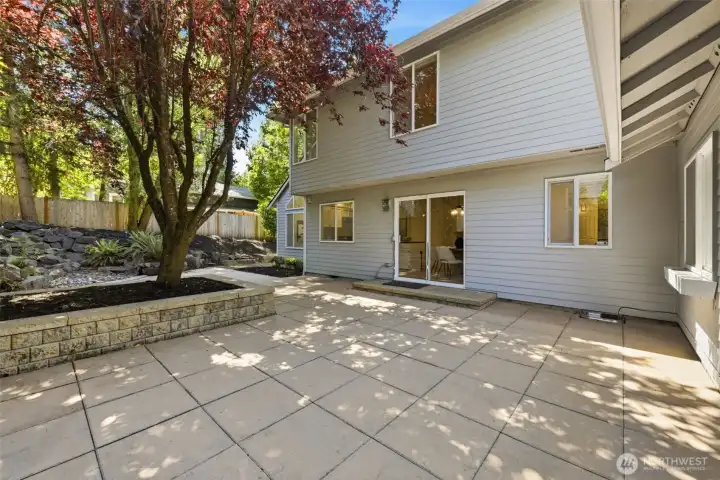 Mature trees shade this expansive patio, meaning you'll want to enjoy it even more on those hot summer days Mature trees shade this expansive patio, meaning you'll want to enjoy it even more on those hot summer days