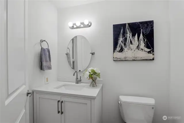 Updated primary bathroom with quartz vanity and undermount sink.