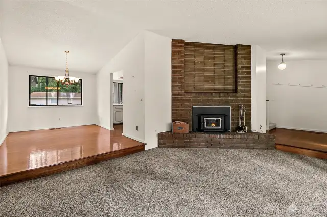 Tall ceilings, newer carpet and hardwood floors compliment the primary living space.