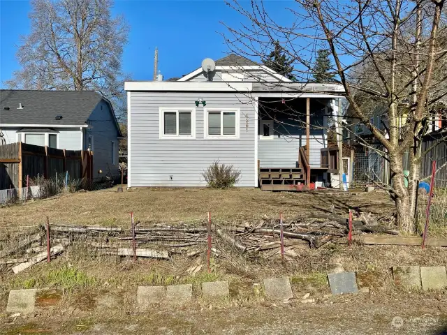 Kitchen addition leads to back porch and yard