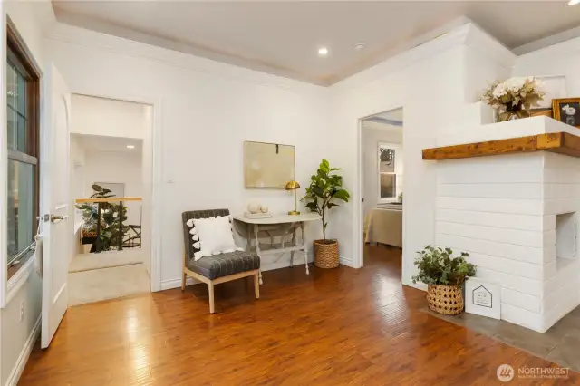 Living room, doors to primary bedroom and rec room.