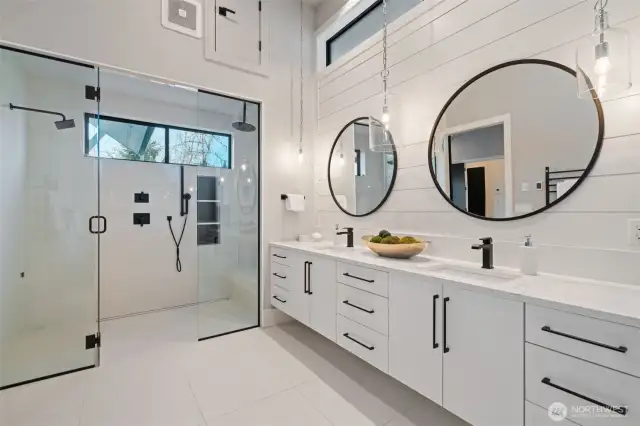 Owner's retreat with soaking tub, dual sinks, walk-in shower, heated floors