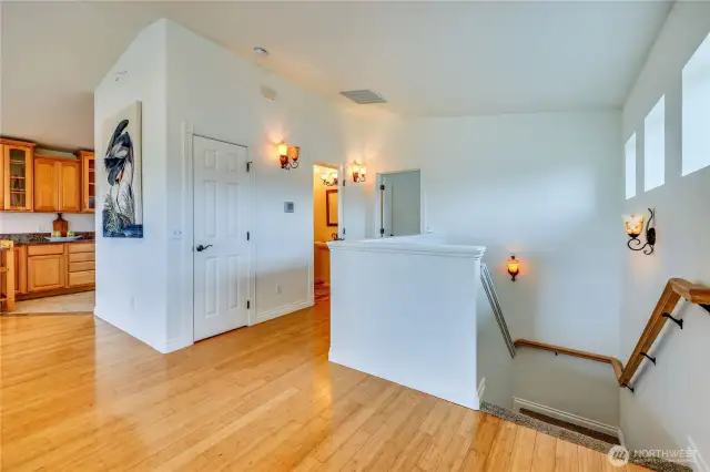 Just off the main living level is the powder room, and beyond that is the Primary Suite.