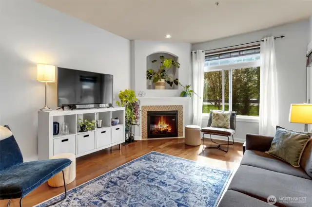 Gas fireplace framed by stylish tile detailing