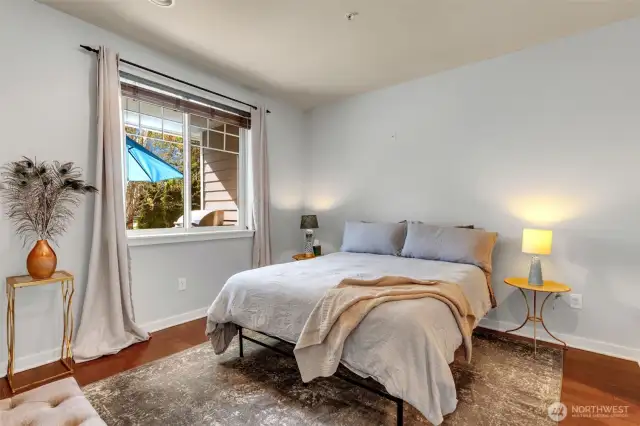 Primary bedroom - window looks out to the patio