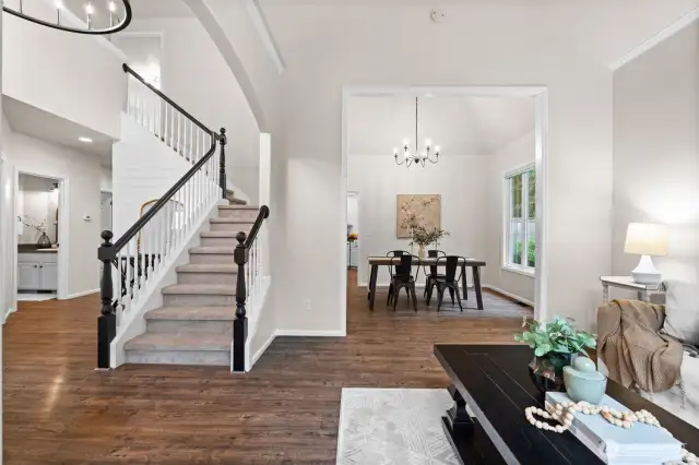 This home makes a stunning entry with a vaulted ceiling, oversized black chandelier and shiplap accent wall.  From the moment you enter, you will feel right at home!