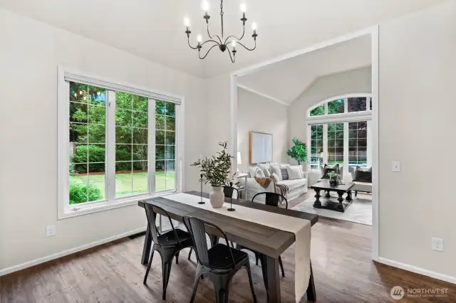 The floor plan is open and airy with easy transitioning from room to room. Luxury vinyl plank flooring throughout the main level blend one room to the next seamlessly for a unified and aesthetically pleasing look.