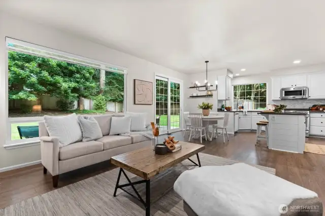 The great room flows into the kitchen area with access to the backyard via sliding glass doors.