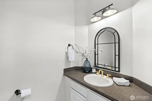 A powder room on the main floor is conveniently located off the foyer and great room.