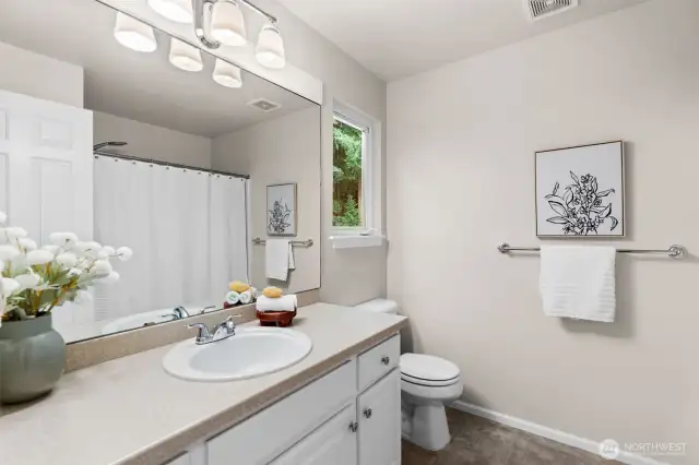 The shared full bathroom is located in the hall between the two bedrooms for ease.