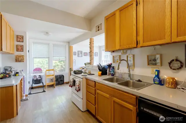 Kitchen facing stairs to basement and utility room.