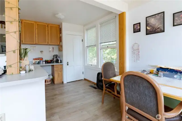 Eating space facing stairs to basement.