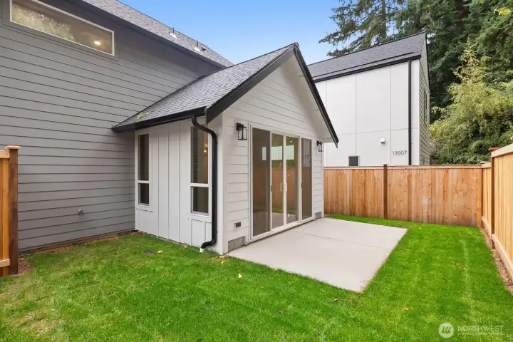 Private fully fenced backyard with patio.