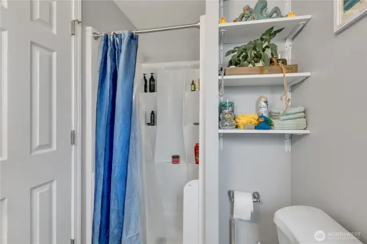 Primary bath has a shower.  Both bathrooms have quartz counters and new fixtures