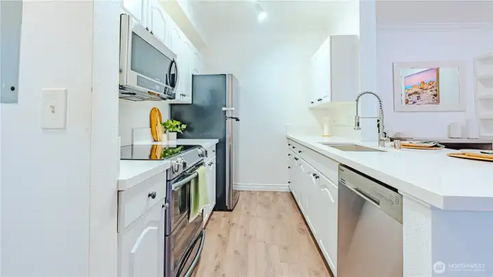Efficient, well designed kitchen featuring stainless steel appliances. Smart use of space and low maintenance living.