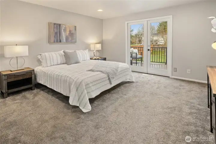 Primary suite with french doors out to the West facing deck