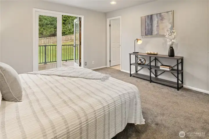 Primary room, looking out to the french doors and own deck