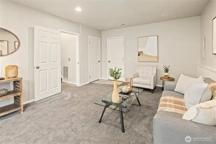 Another view of the family room with access out to the 2 car garage