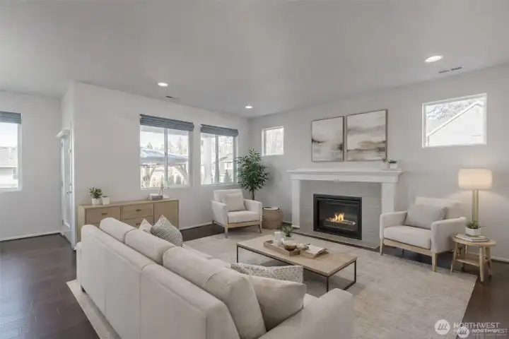 Virtually staged. Light-filled great room with focal fireplace.