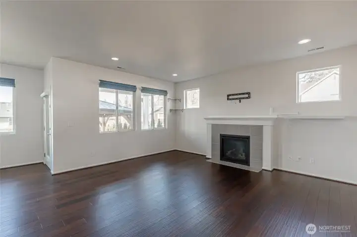 Light-filled great room with focal fireplace.