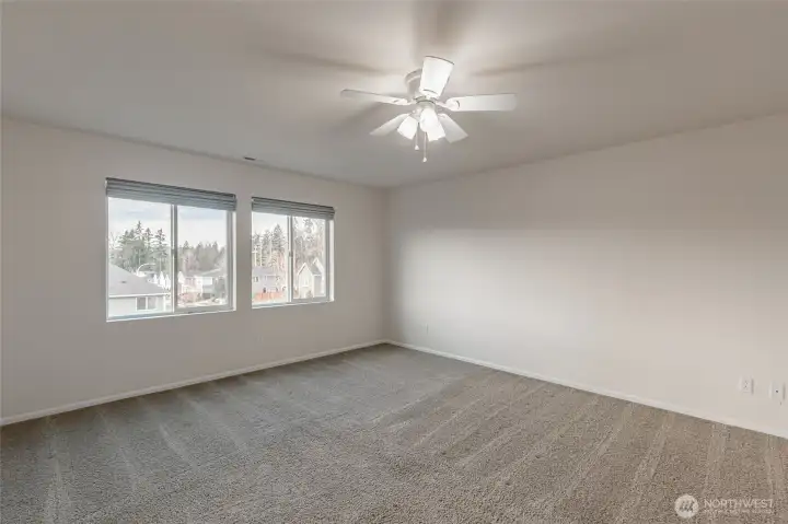 Another view of the primary bedroom. Calm, neutral tones create a serene retreat.