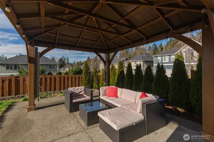 Covered pergola in the backyard is perfect for relaxing or entertaining.