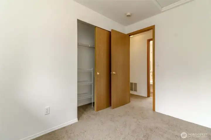 One of the upstairs bedrooms with generous closet space. Fresh interior Paint and new carpet through-out.