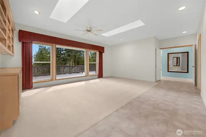 Living room with the double door entry into master suite where you see the mirror on the wall.