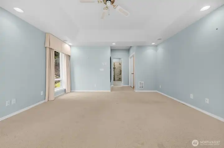 Primary suite looking toward the 5 piece bath and walk-in closet.
