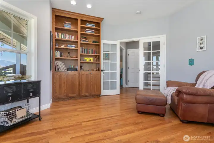 Custom built in shelving in the expansive office.