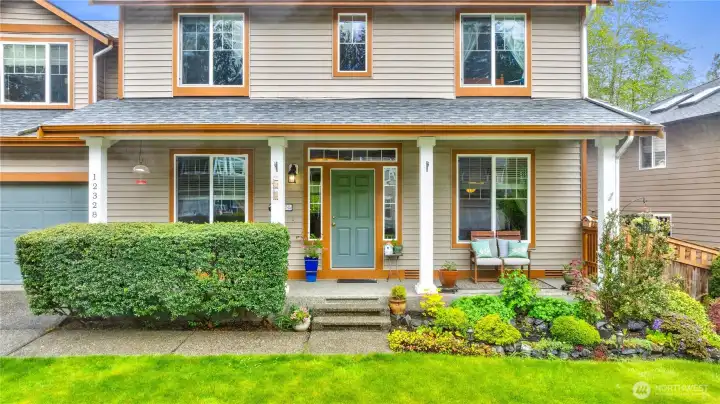 Beautiful front porch where you an sit and enjoy the native growth