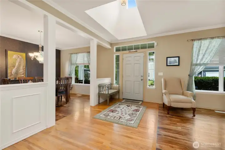 Large bright entry with sky light, open floor plan throughout the home