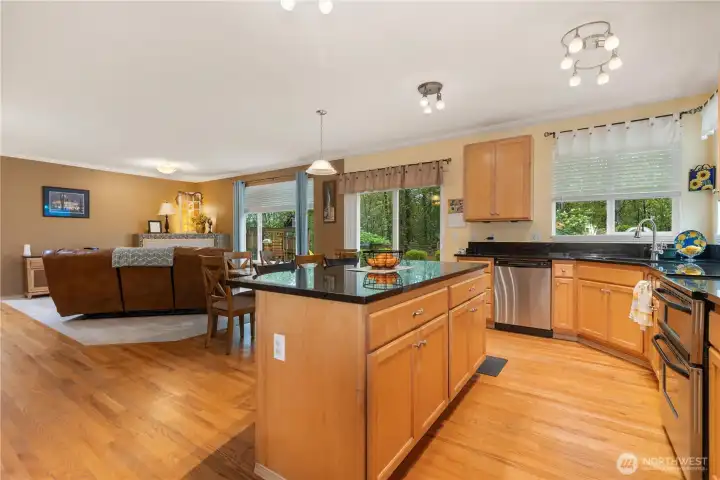 Spacious eat in kitchen with bar top, and open to family room